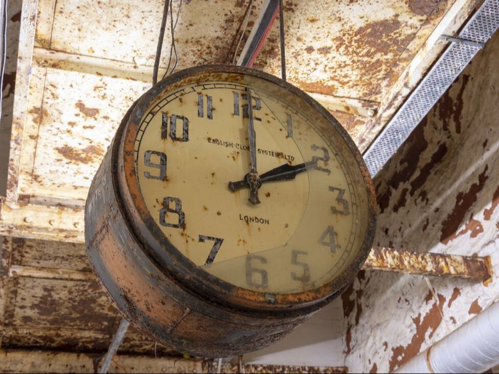old clock in disused factory