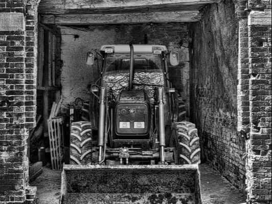 Old Tractor in barn, black and white, b&w