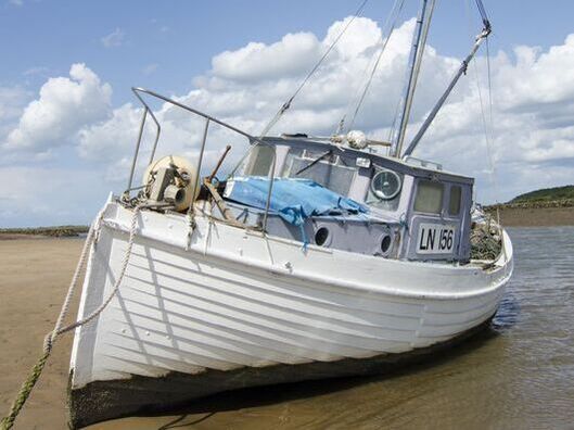 Boat at low tide Burnham