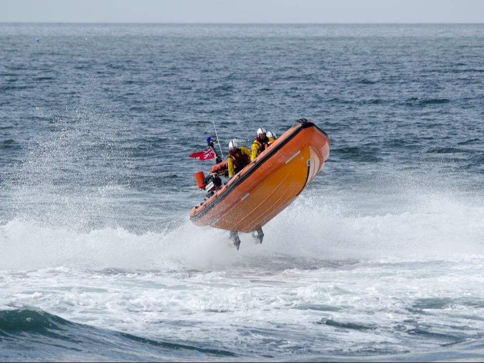 lifeboat jumping through surf