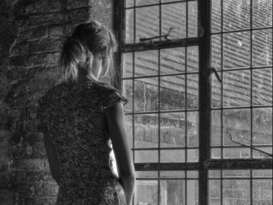 girl at window black & white