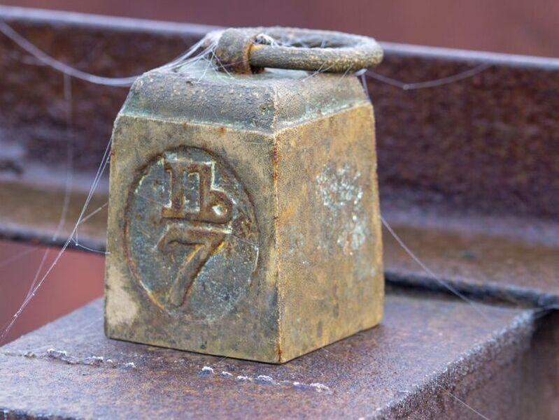 Old weight,antique, rusty